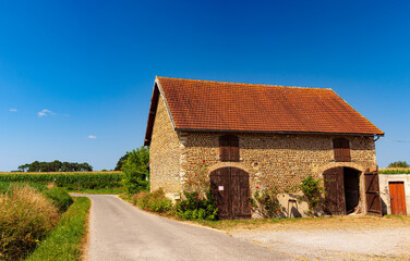 Fototapeta na wymiar View of typical farmhouse in the landes countryside along Le Puy Route, France