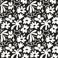 Abstract seamless pattern with cute hand drawn meadow flowers. Stylish natural background. Hand drawn design elements.