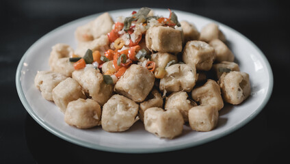 fried tofu crispy on a plate with chili 