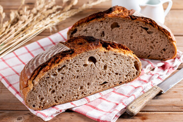 Homemade bread on wooden table. Bread texture of whole grain bread