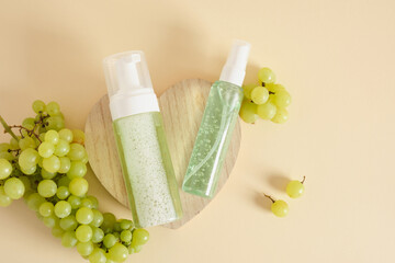 differrent mock up bottles with natural cosmetic with grapes extract