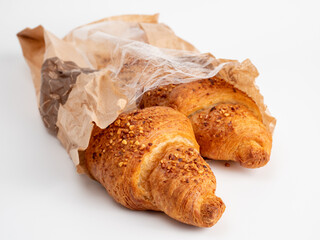 Baked goods croissant on a white background.