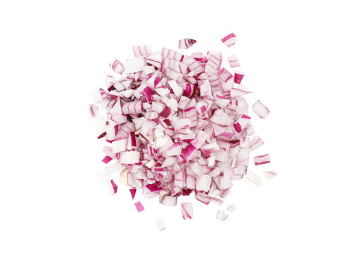 Sliced raw purple onion, small cubes, heap, isolated on white background, top view, close-up