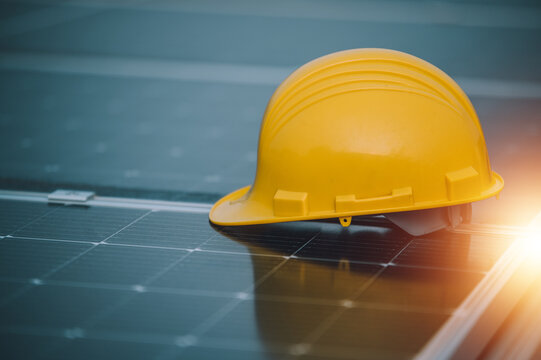 Yellow helmet safety on solar cell roof top factory