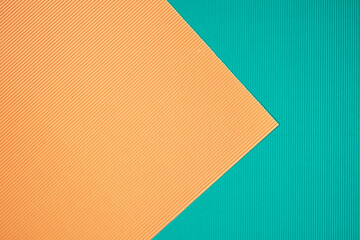 Turqoise and orange two tone color paper background with stripes. Abstract background modern hipster futuristic. Texture design