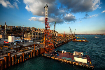 pile driving  at sunset