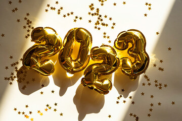 2023 number made from foil golden balloons. New year concept.