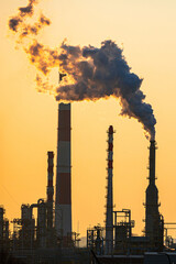 Working oil refinery. Smoke from the factory chimney. Ecological pollution. Air emissions polluting...