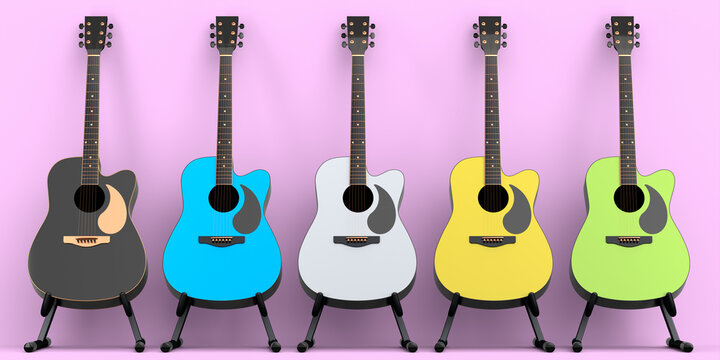 Set of acoustic guitar isolated on pink background.