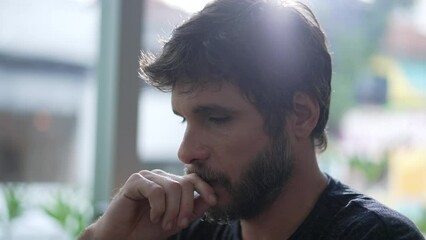 Thoughtful man thinking solution. One pensive person pondering solving hard problem. Individual trying to remember memory seated at coffee shop