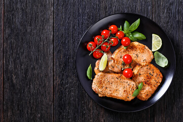 tomato basil pesto fried pork cutlets on plate