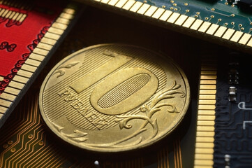Russian coin with a face value of 10 rubles. lies among the microcircuits. (the concept of the digital economy of Russia)
