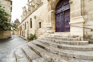 Fototapeta na wymiar Street in old town, Paris France entrance of old church