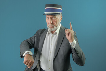 The conductor warns the passenger about the time of departure of the train. On a blue background.
