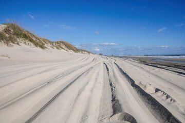 vehicle tracks on the beach,blue,