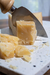 Italian cheese collection, piece of old matured grana padana cheese made from cow milk in Italy