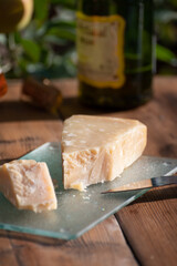 Cheese pairing with drinks,  parmigiano reggiano or parmesan cheese and French apple cider served outdoor