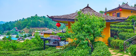 Panorama of Ban Rak Thai Yunnan tea village with tea shrubs and Chinese houses, Thailand