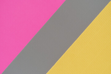 Gray, pink and yellow three tone color paper background with stripes. Abstract background modern hipster futuristic. Texture design