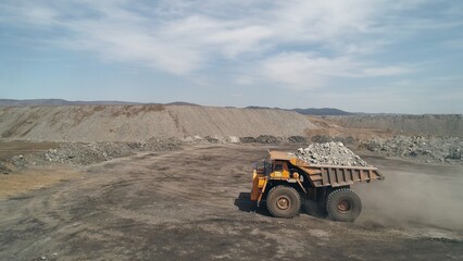 Place where waste rock tailings are dumped from coal pit. Big truck unloading