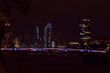 Fototapeta na wymiar Colorful cityscape of London at night. Urban landscape illuminated.