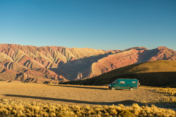 Campervan in the Serrania del Hornocal in Jujuy, Argentina at sunset.