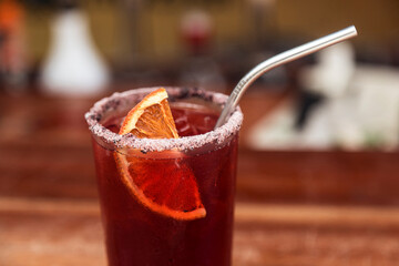 Orange cocktail. Glazed rim of the glass. Natural, restaurant. Refreshing