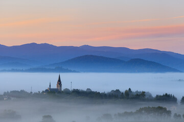 church in the mountains on a foggy spring morning, Lutowiska © uranos1980