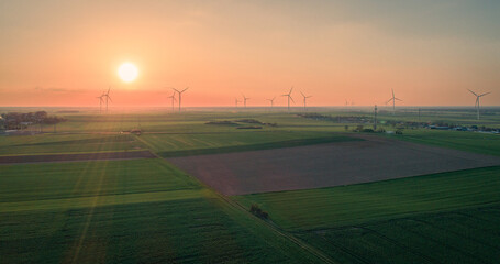 Sunset over the fields and windmills