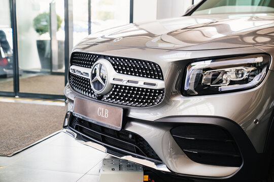 logo and grille radiator. part of a grey Mercedes GLB car.