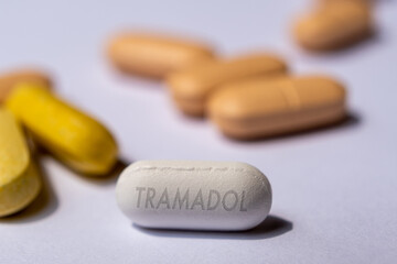 Obraz na płótnie Canvas White Tramadol opioid pill drug medication used to treat pain, both acute and chronic and potential for fibromyalgia.