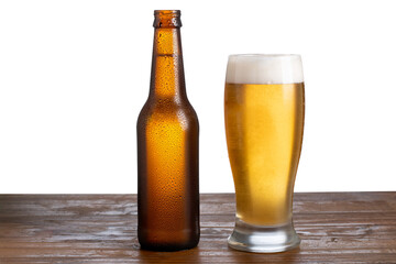unlabeled beer bottle and glass with beer on white background