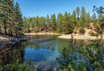 The small bay and sandy beach at Black Bay Park in the rural town of Post Falls, Idaho, near Coeur...