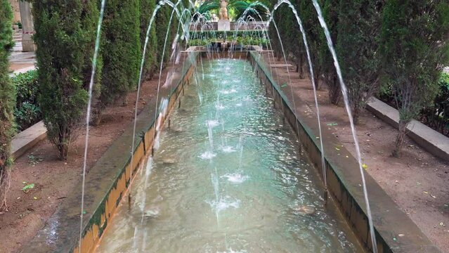 Tilt over the Fountain of Hort del Rei gardens near the Almudaina - Palma de Mallorca, Spain
