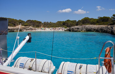 Menorca, Spain: Beautiful bay with sailing boat catamaran