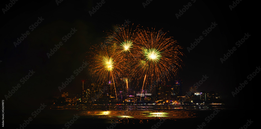 Poster a night sky with multiple fireworks exploding in the distanc