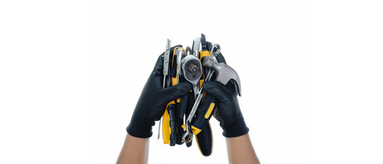 Obraz na płótnie Canvas two hand wearing black gloves holding different types of black yellow hand tools isolated white background