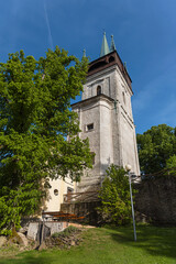 The Bolfanek (Bolfánek) lookout tower with the St. Wolfgang´'s cemetery chapel. Near Chudenice village, Czech republic. 
