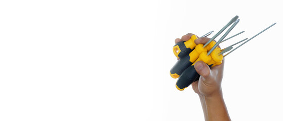 hand holding different types yellow black screwdriver isolated white background