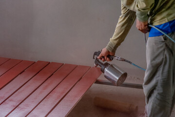 Professional painters are painting the interior of the house.