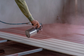 Professional painters are painting the interior of the house.