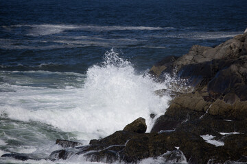 Ocean waves crashing onto a rocky shore