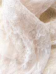 the detail of tulle lace fabric with flower pattern, selective blurred focus