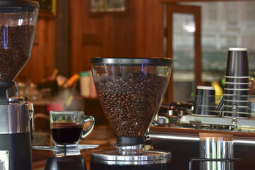 Coffee is a cup of coffee placed on the floor.