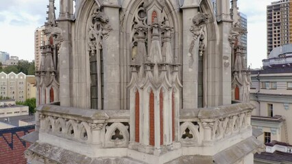 Ancient gothic roman catholic church in Kiev. Urban city scape background.