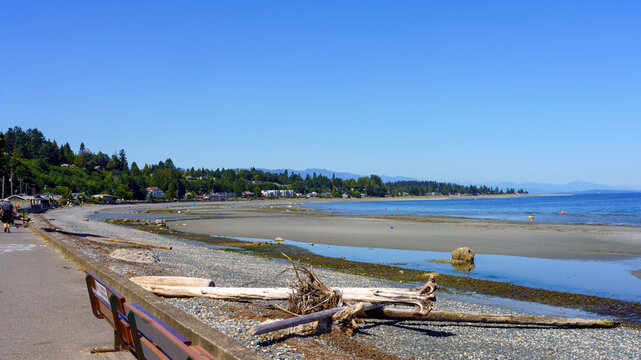 Beach stroll at the town of Qualicum Beach, BC, on a bright mid-summer day.