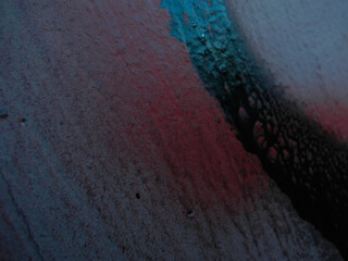 Bright streaks of paint on a wall. Empty abstract background.