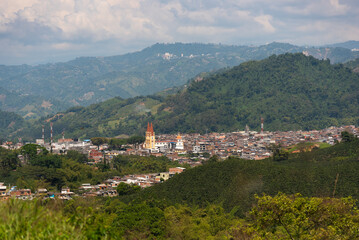 Fototapeta na wymiar Panoramic view of a church in a country town between hills in Colombia
