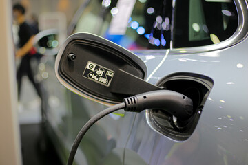Plug socket charging Electric vehicle EV concept of new technology for automobile vehicles use...