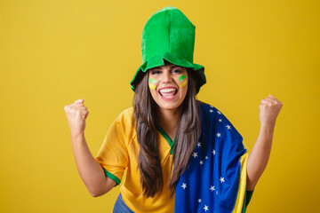 Woman supporter of Brazil, world cup 2022, wearing typical fan outfit to go to the game, brazil...